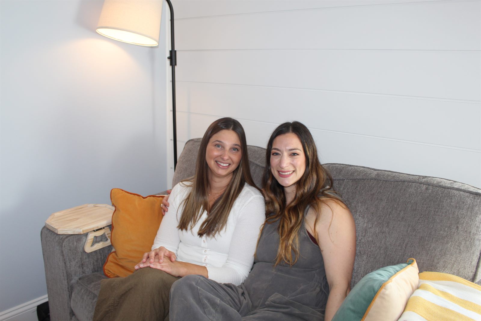 Sam and Jackie sitting together on the couch in the therapy office