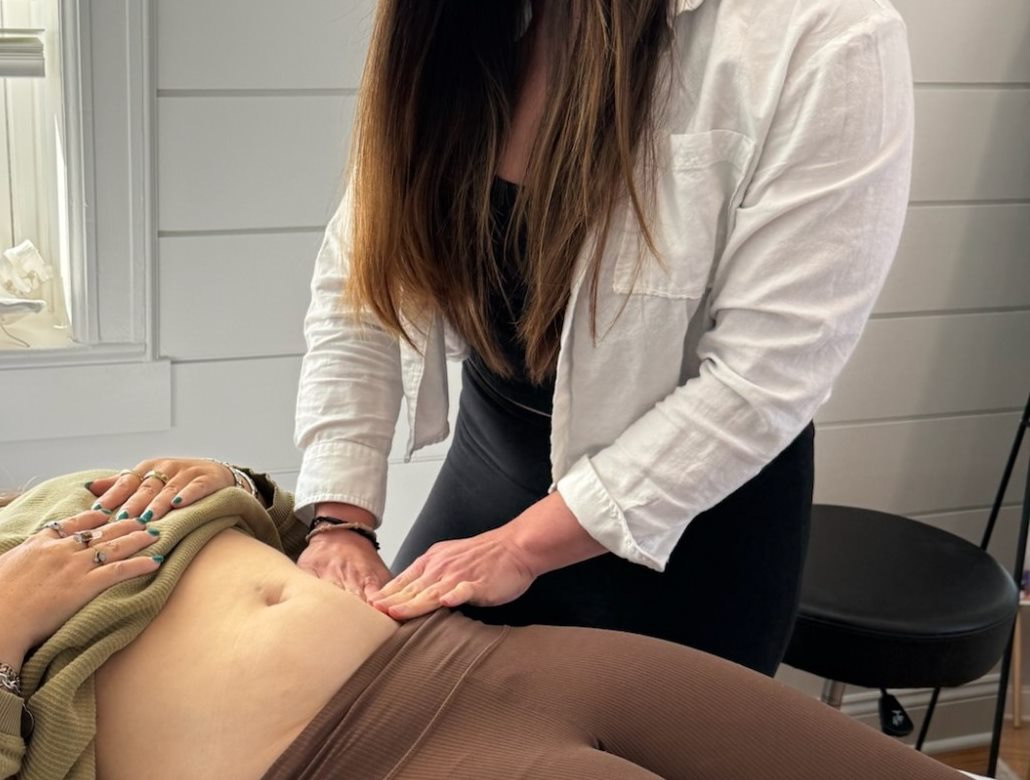 Therapist performing Mercier Therapy abdominal work on a client